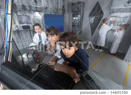 Children playing in bunker quest room Children playing in bunker quest room 54605390