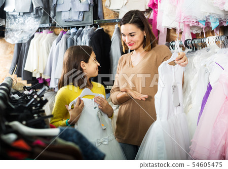 Family choosing dress in shop 54605475