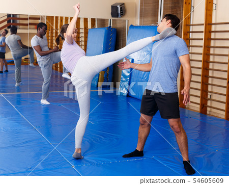 People practicing self defense techniques People practicing self defense techniques 54605609