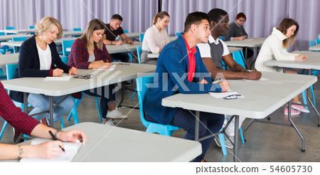 Adult students listening in classroom Adult students listening in classroom 54605730