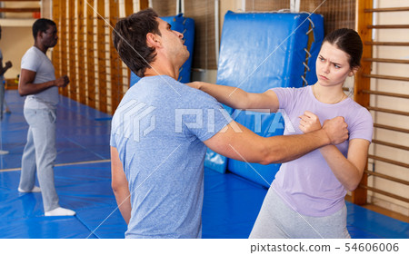 People practicing self defense techniques People practicing self defense techniques 54606006