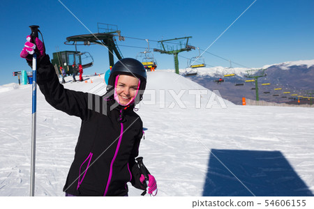 cheerful woman skiing on snowy mountain. cheerful woman skiing on snowy mountain. 54606155