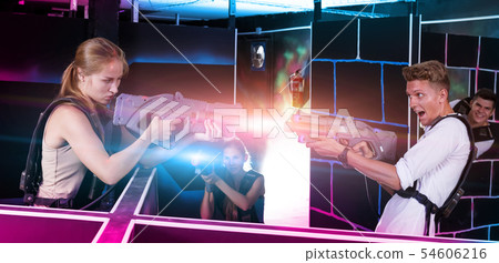 guy and female with laser guns 54606216