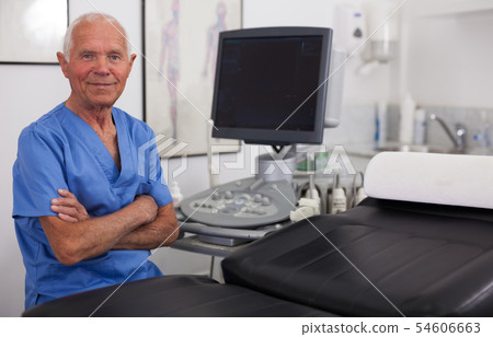 Elderly man hospital doctor in cabinet of ultrasound test Elderly man hospital doctor in cabinet of ultrasound test 54606663