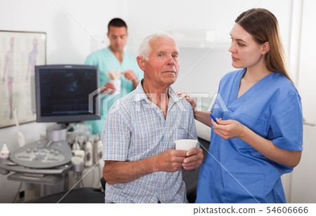 Woman doctor and elderly man patient before ultrasound diagnostic 54606666