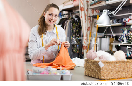 Woman is doing overlay of dress for new fashion collection 54606668
