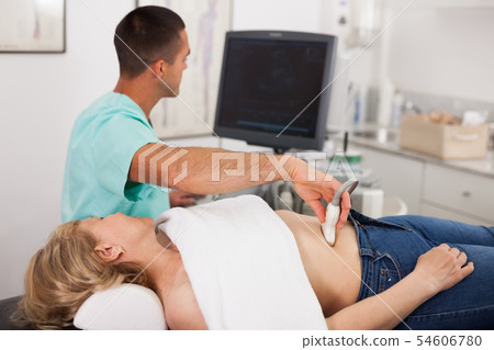 Female patient during ultrasound diagnostic 54606780