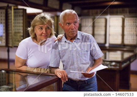 Man and woman with guidebook at Museum 54607533