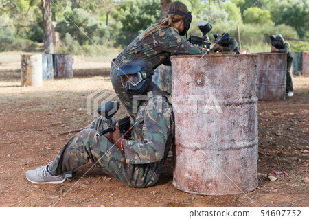 Teams facing in paintball arena 54607752