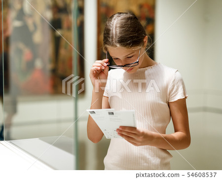 Teenage girl visiting museum 54608537