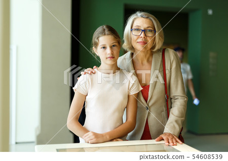 Woman and girl visiting museum 54608539