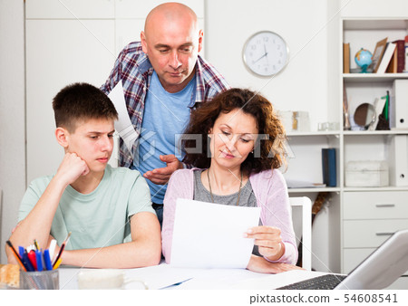 Family working with papers Family working with papers 54608541