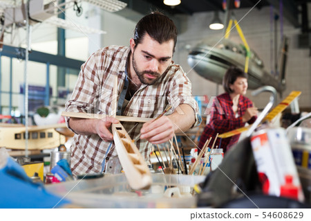Male hobbyist creating plane models Male hobbyist creating plane models 54608629