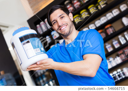 seller showing different sport nutrition 54608715