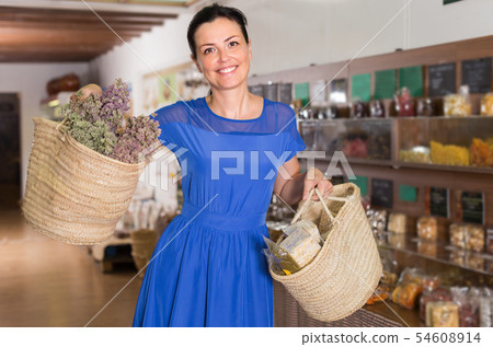 Female is showing shopping bags with purchases 54608914