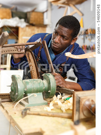 Process of renewing vintage chair 54609148