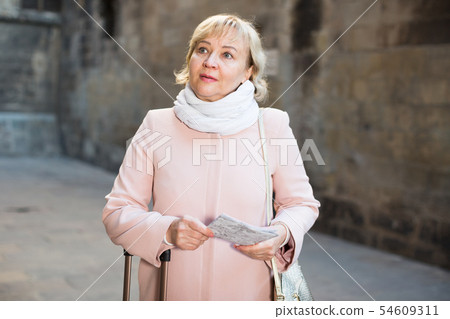 adult woman holding map guide 54609311