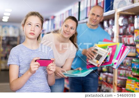 Parents trying to draw daughter attention Parents trying to draw daughter attention 54609393