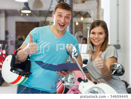 Man and woman is pleased with the purchase 54609449