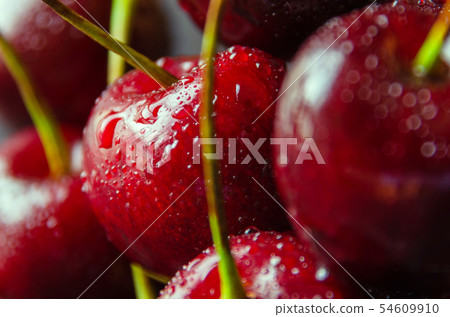 Close up of fresh cherry berries with water drops. 54609910