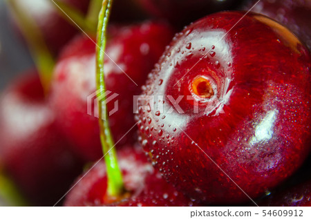 Close up of fresh cherry berries with water drops. 54609912