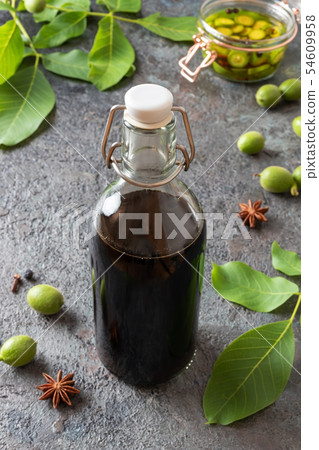 A bottle of homemade walnut liqueur A bottle of homemade walnut liqueur 54609958