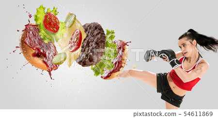 Burger's crashing by the boxer isolated on white background 54611869