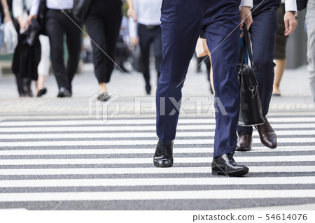 Businessman foot crossing the pedestrian crossing 54614076