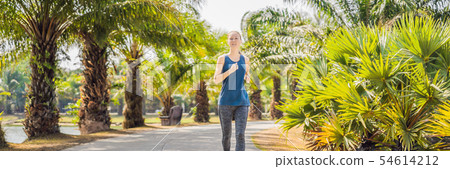 Runner athlete running at tropical park. woman fitness sunrise jogging workout wellness concept Runner athlete running at tropical park. woman fitness sunrise jogging workout wellness concept 54614212