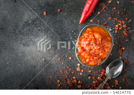 Traditional adjika hot chili pepper sauce harissa. Traditional adjika hot chili pepper sauce harissa. 54614770