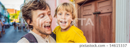 BANNER, LONG FORMAT Dad and son tourists on the Street in the Portugese style Romani in Phuket Town 54615337