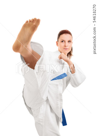 Girl in kimono demonstrating a kick Girl in kimono demonstrating a kick 54618270