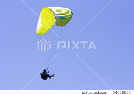 Paragliding in the blue sky as background extreme Paragliding in the blue sky as background extreme 54618605