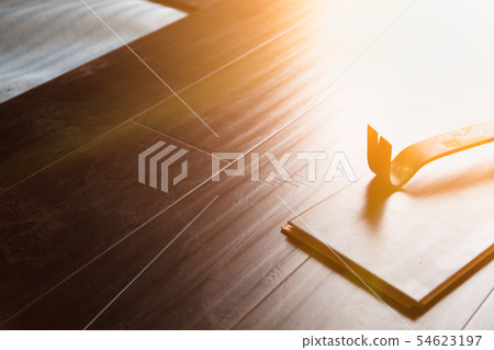 Pry Bar Tool with New Laminate Flooring 54623197