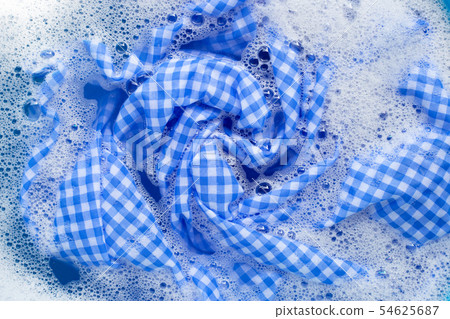 Blue white tablecloth  soak in powder detergent 54625687