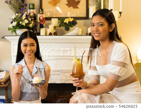Best friends smile together for beautiful cake Best friends smile together for beautiful cake 54626825