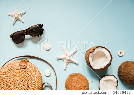Flat lay with ripe coconuts on blue background. Flat lay with ripe coconuts on blue background. 54629432