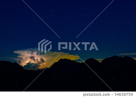 Hotaka mountain range and thunder clouds seen from the Northern Alps, Mt. Ashigatake at night Hotaka mountain range and thunder clouds seen from the Northern Alps, Mt. Ashigatake at night 54630759