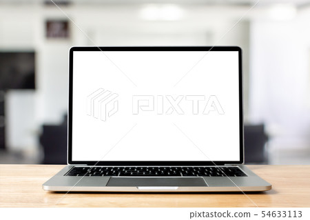 Laptop blank screen on wood table with office room 54633113