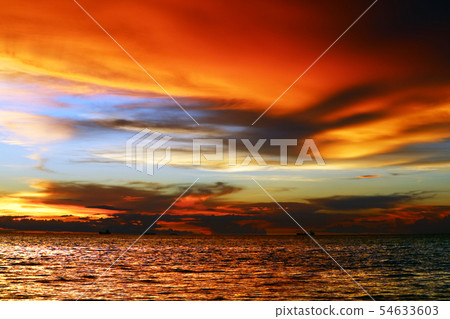sunset on sea and colorful flame cloud cold sky sunset on sea and colorful flame cloud cold sky 54633603