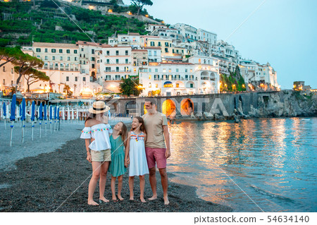 Adorable little girl on sunset in Amalfi town in Italy Adorable little girl on sunset in Amalfi town in Italy 54634140