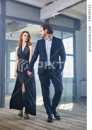 stylish actors posing on a concrete background 54638415