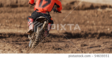 Racer child on motorcycle participates motocross 54639351