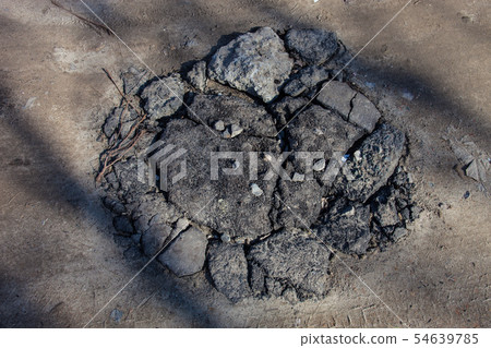 Heap of broken asphalt and concrete blocks pieces 54639785