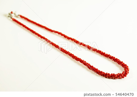 Three red necklaces and white background Three red necklaces and white background 54640470