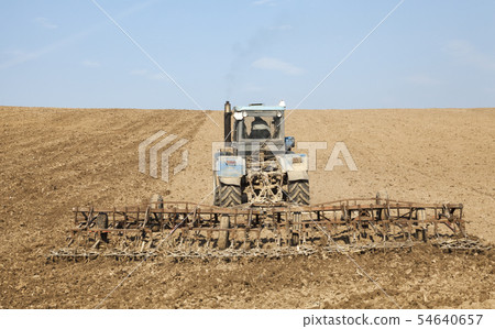Harrowing the soil with tine harrows 54640657