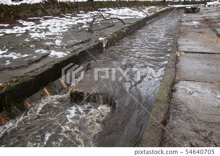 Urban stream in winter. The Lybid river. 54640705