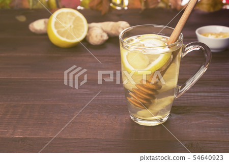 Autumn hot tea warming drink with ginger, honey 54640923