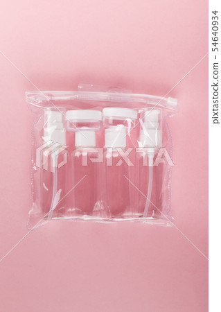 Travel small bottle set on a pink background. Top Travel small bottle set on a pink background. Top 54640934