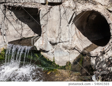 Run-off pipes discharging water 54641503